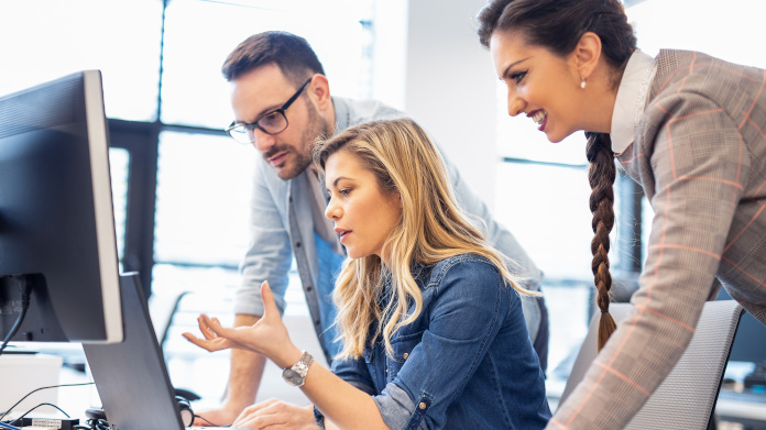 Three employees focusing on an intellectual task