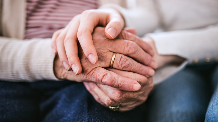 Older person’s hands showing wrinkles and ageing spots