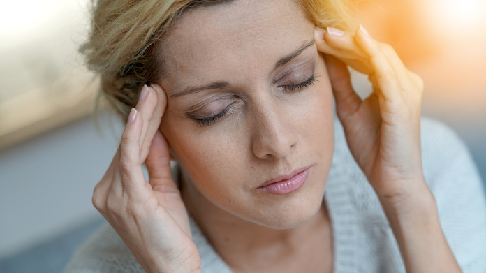 Woman suffering from a migraine